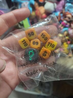 orange gradient Pokémon Trading Card Game (TCG) damage-counter dice